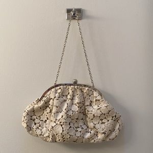 Cream and gold colored bag
